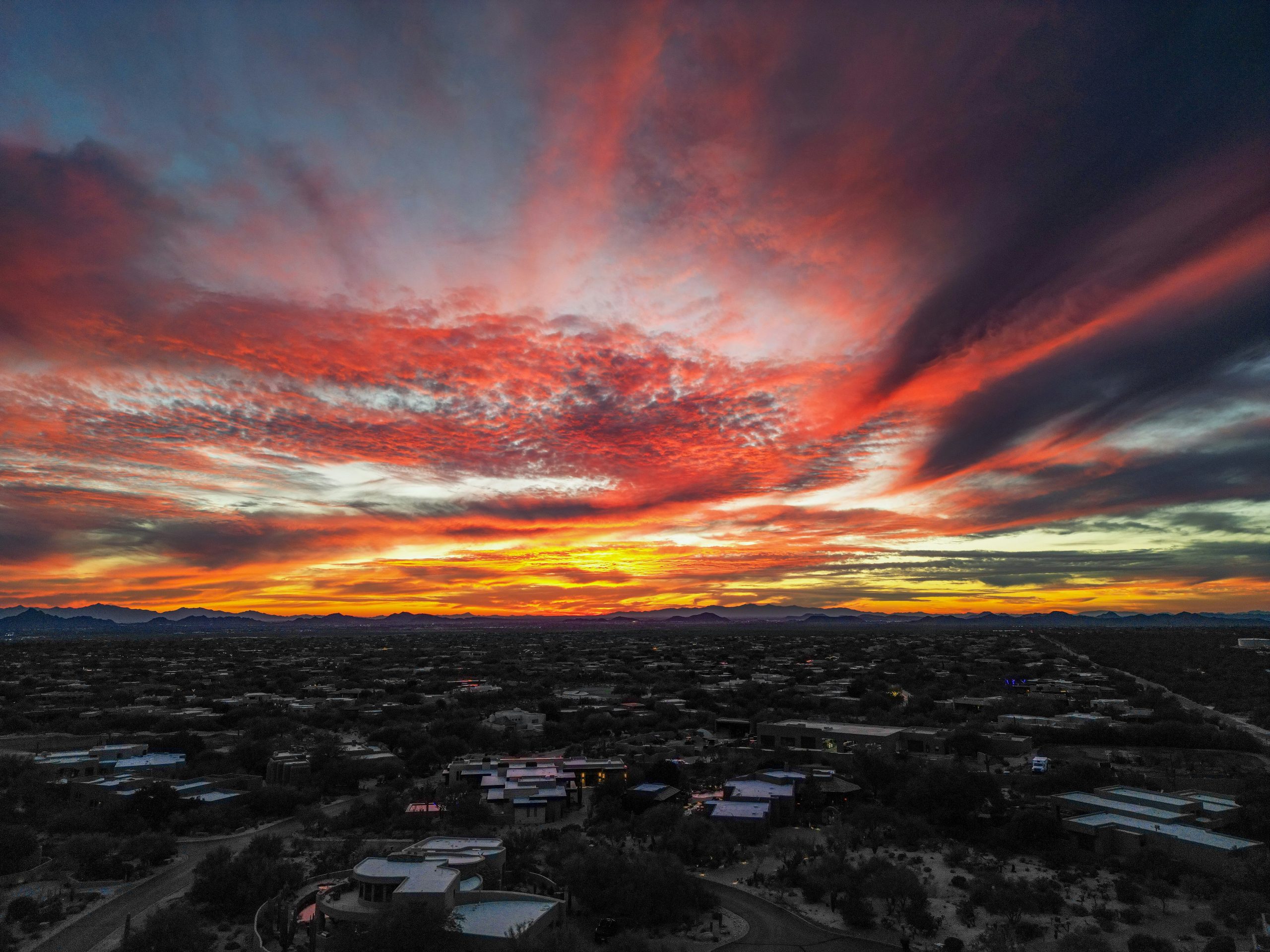 Arizona neighborhood and mountains at sunset